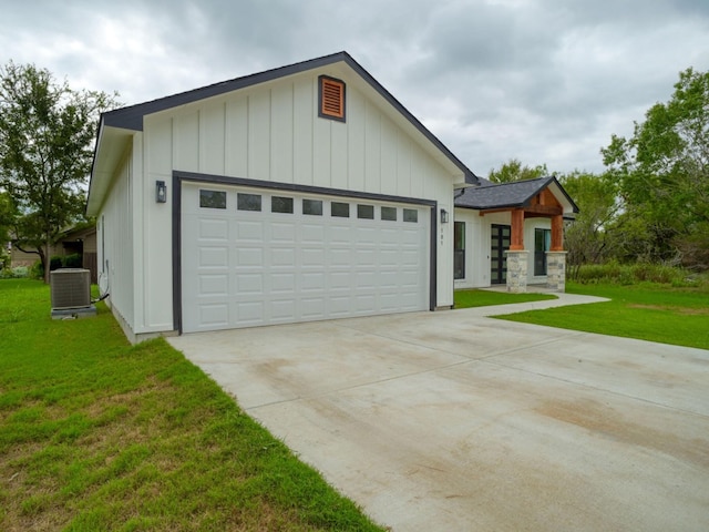 view of front of house featuring central air condition unit, an attached garage, board and batten siding, driveway, and a front lawn