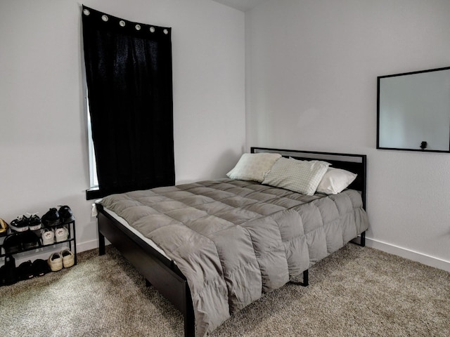 bedroom featuring carpet