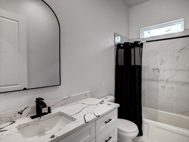 full bathroom with vanity, toilet, and shower / tub combo