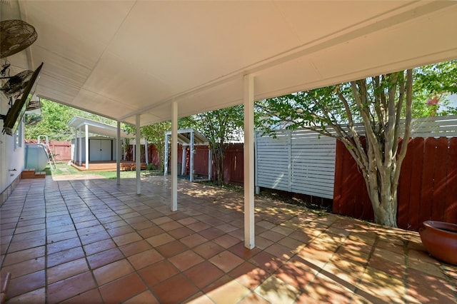 view of patio / terrace with a storage shed