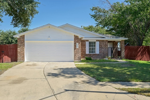 ranch-style home with a garage and a front lawn