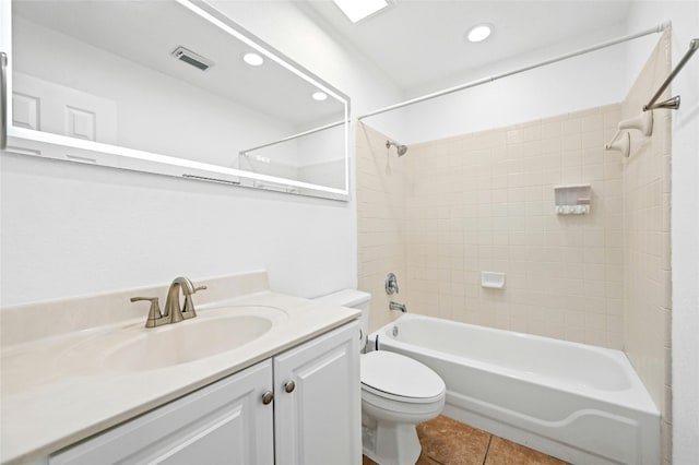 full bathroom with tile patterned flooring, vanity, toilet, and tiled shower / bath