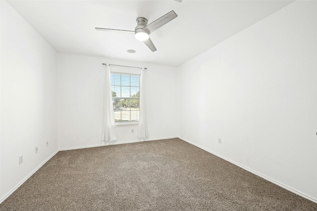 carpeted empty room with ceiling fan