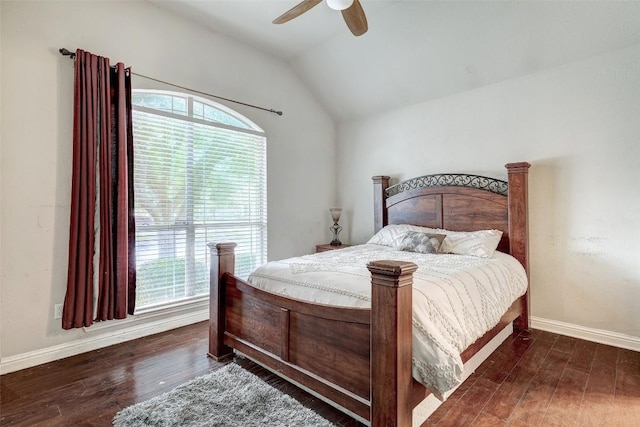 bedroom with a ceiling fan, lofted ceiling, wood finished floors, and baseboards