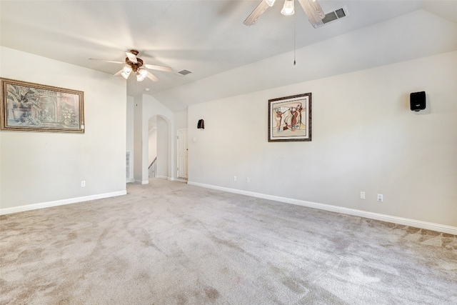 carpeted spare room with lofted ceiling and ceiling fan