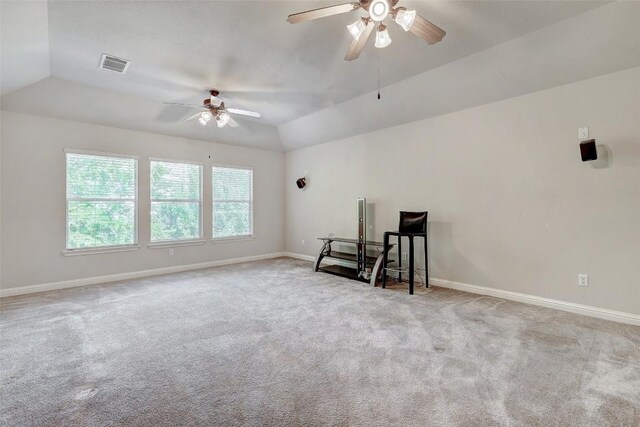 unfurnished room featuring visible vents, baseboards, lofted ceiling, and carpet floors