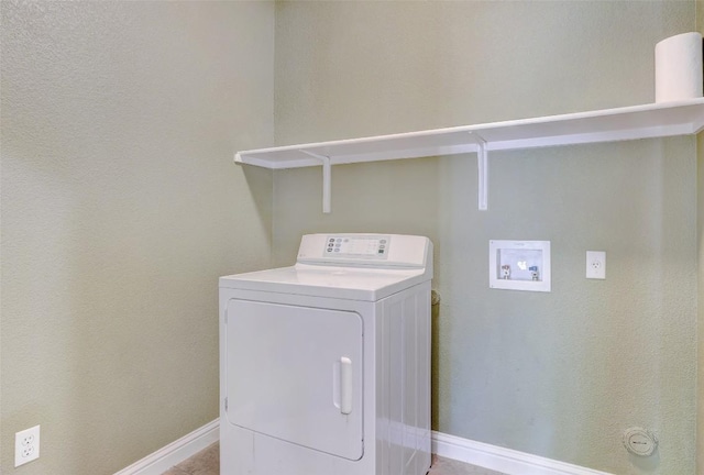 laundry room featuring washer / dryer, baseboards, and laundry area