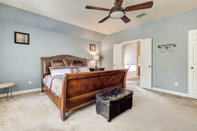 carpeted bedroom featuring lofted ceiling and ceiling fan