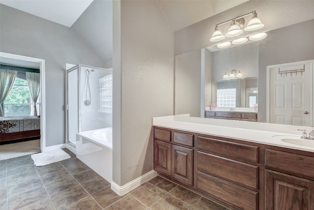 bathroom with plus walk in shower, tile patterned floors, a notable chandelier, lofted ceiling, and vanity