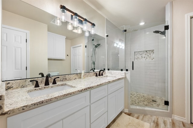 bathroom featuring vanity and walk in shower