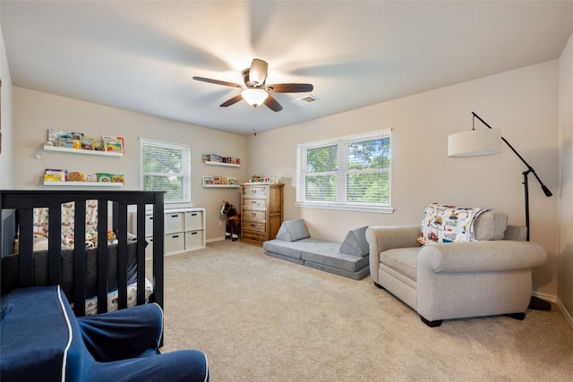 carpeted bedroom featuring ceiling fan