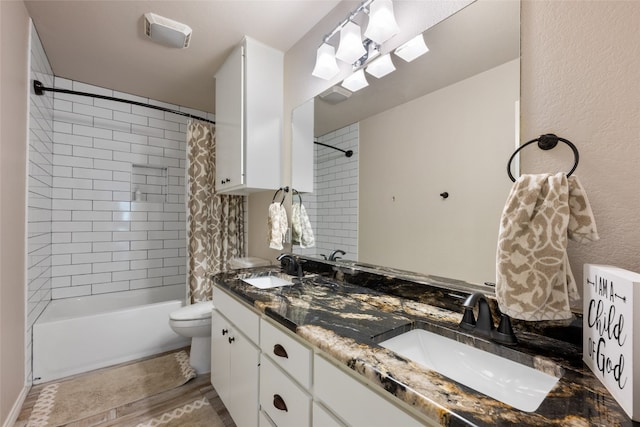 full bathroom with vanity, toilet, and shower / bath combo