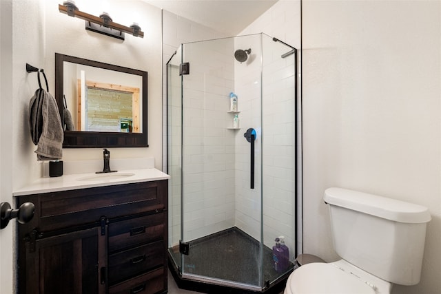 bathroom with vanity, toilet, and walk in shower