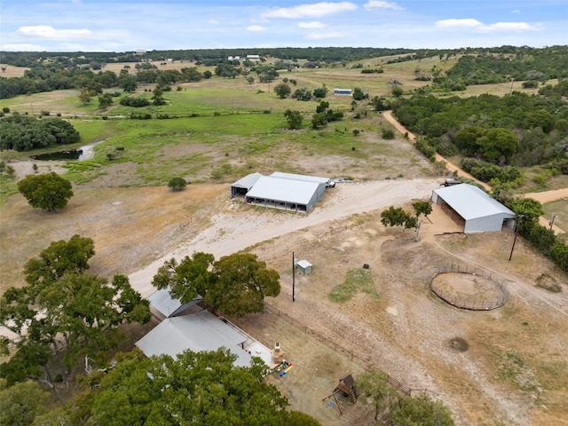 birds eye view of property featuring a rural view