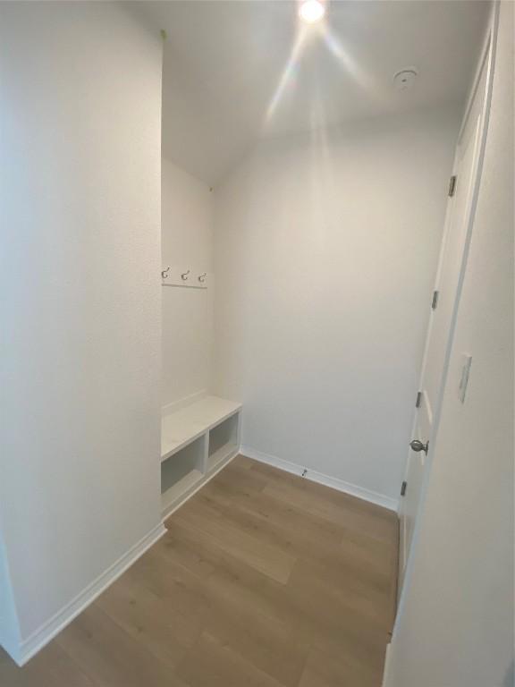 mudroom with light hardwood / wood-style floors