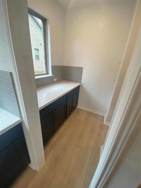 bathroom with hardwood / wood-style floors