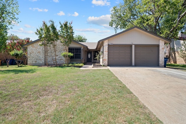 ranch-style home featuring a garage and a front lawn