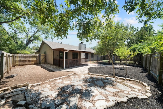 rear view of property featuring a patio area