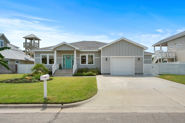 view of front of home featuring a garage and a front lawn