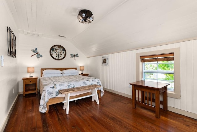 bedroom featuring dark hardwood / wood-style floors, vaulted ceiling, and wood walls