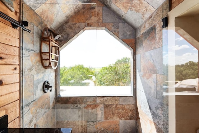 interior details with a tile shower