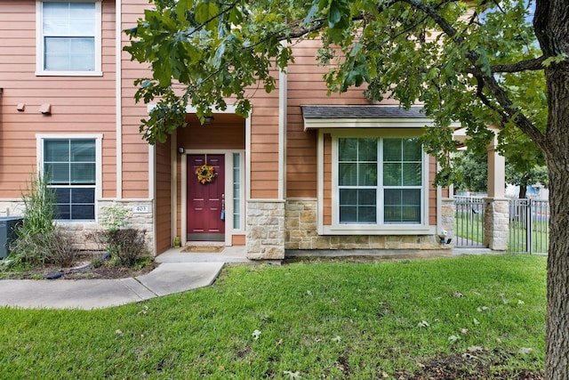 entrance to property with a yard