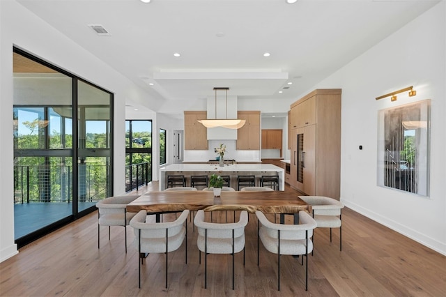 dining area with light hardwood / wood-style flooring