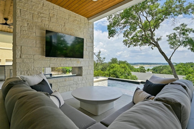 view of patio / terrace with ceiling fan and an outdoor hangout area