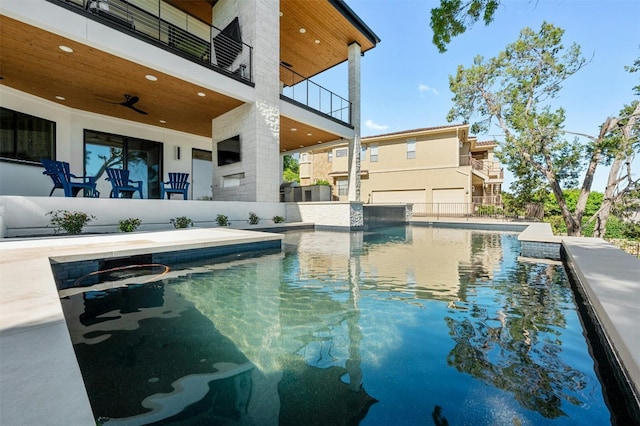 view of pool featuring ceiling fan