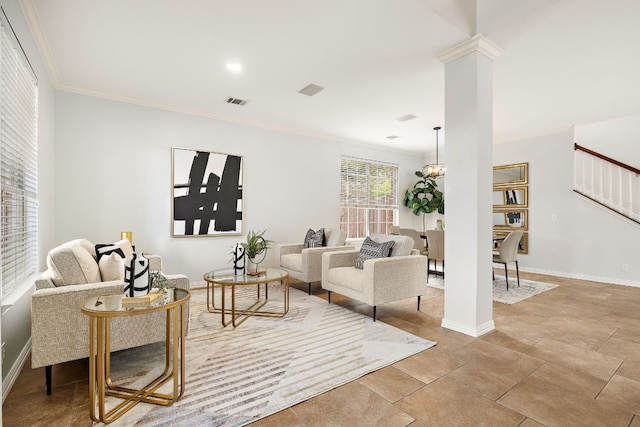 tiled living room with ornate columns, crown molding, and a chandelier