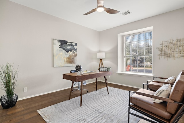 office with ceiling fan and dark hardwood / wood-style flooring