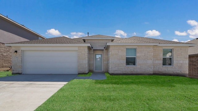 view of front facade featuring a garage and a front lawn