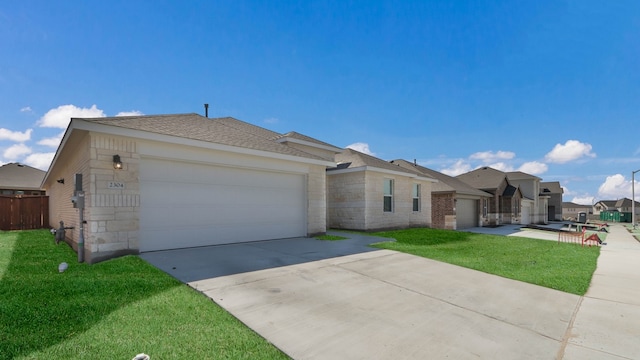 ranch-style home featuring a front yard and a garage