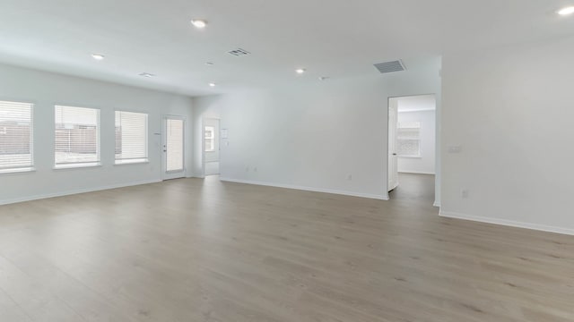 spare room featuring light hardwood / wood-style floors