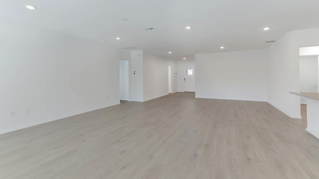 empty room with light hardwood / wood-style floors