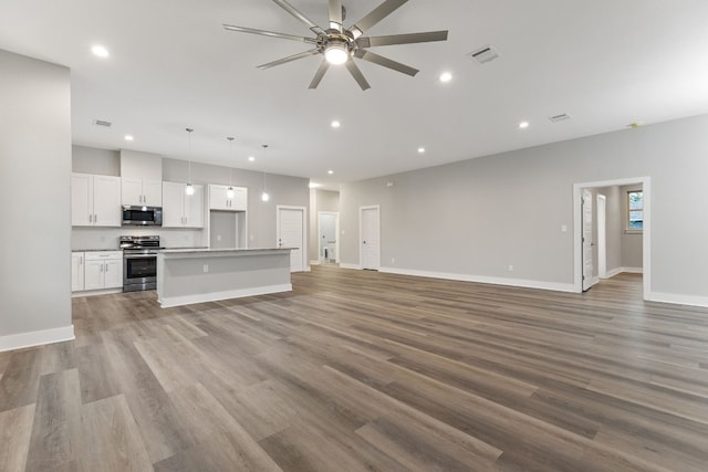 unfurnished living room featuring light wood-type flooring and ceiling fan