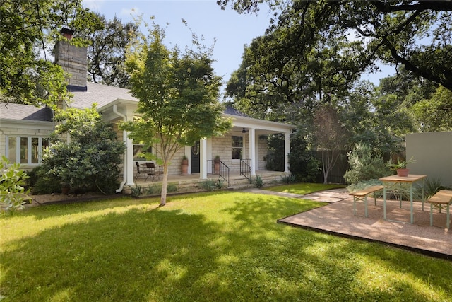 exterior space with a patio area and a yard