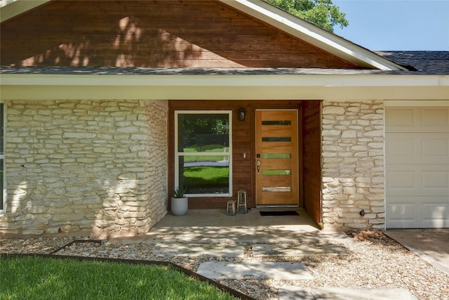 property entrance with a garage