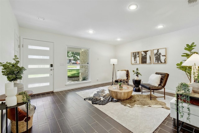 sitting room featuring dark wood-type flooring