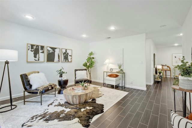 sitting room featuring dark hardwood / wood-style flooring