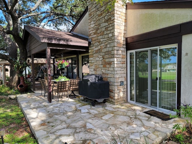 view of patio featuring a grill