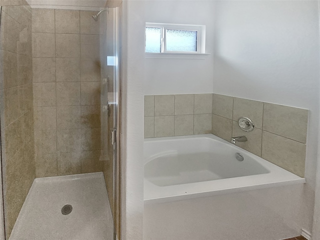 bathroom featuring plus walk in shower