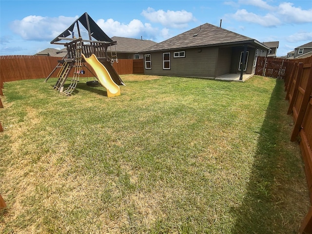 view of yard with a playground