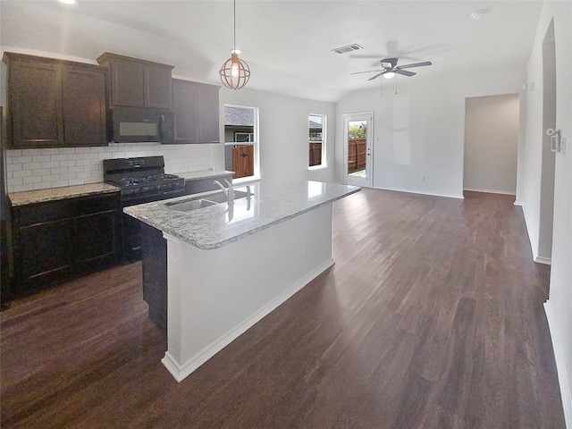 kitchen featuring black appliances, sink, decorative backsplash, ceiling fan, and dark hardwood / wood-style floors