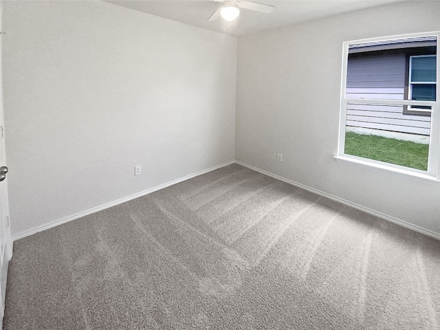 carpeted empty room with ceiling fan