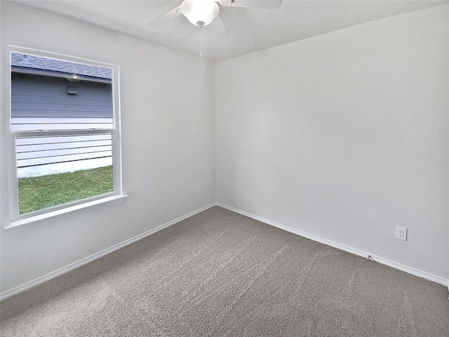 carpeted empty room featuring ceiling fan