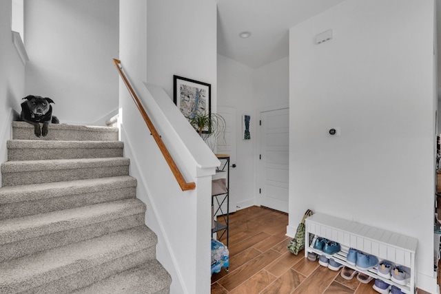 stairs with hardwood / wood-style floors