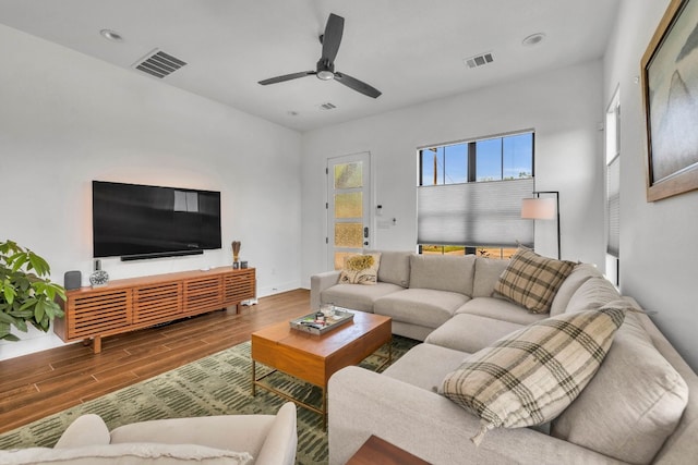 living room with ceiling fan and hardwood / wood-style flooring