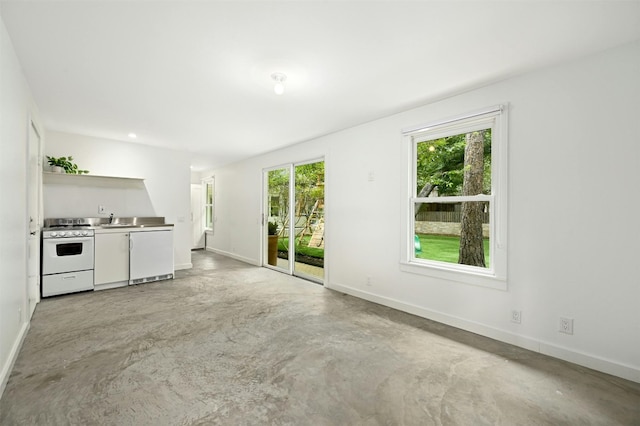 unfurnished living room featuring plenty of natural light