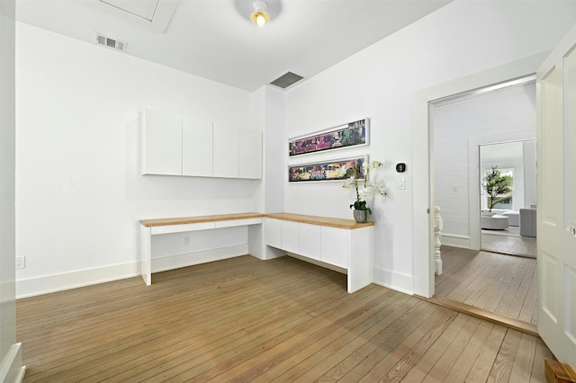 unfurnished office featuring light hardwood / wood-style flooring